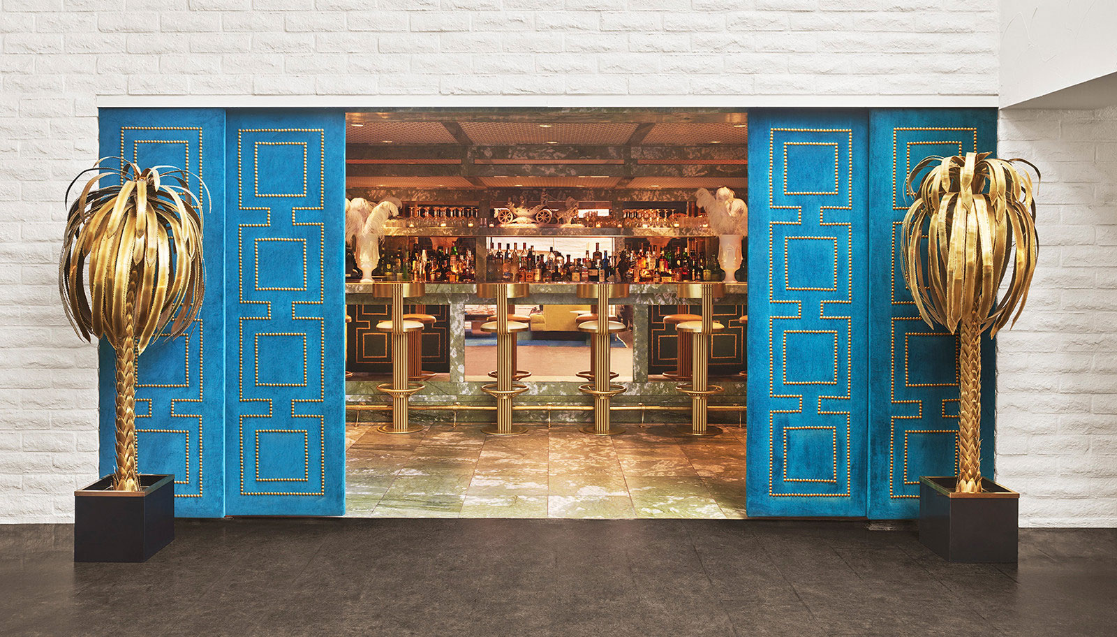 A bar area with blue doors and gold accents