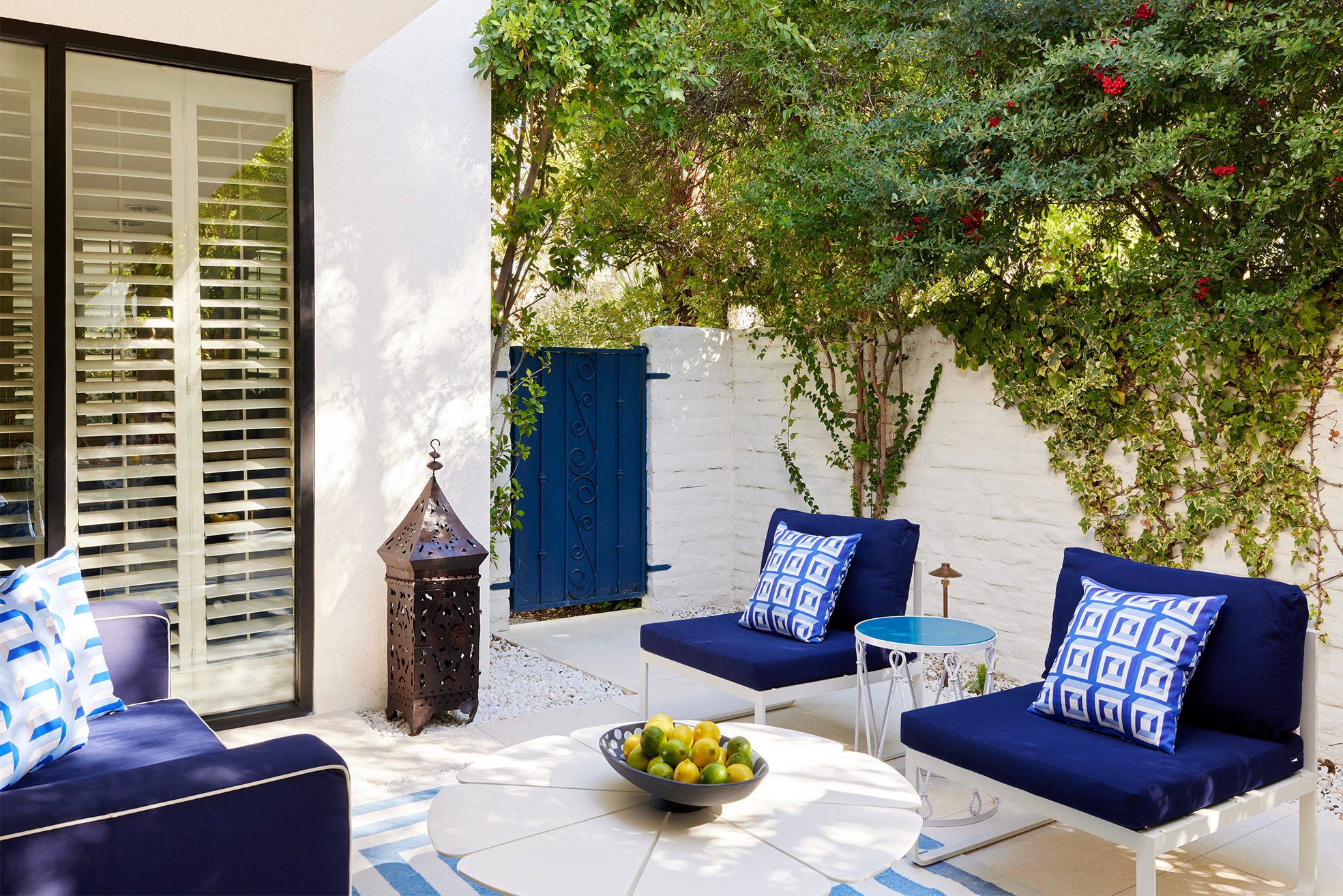 outdoor seating area with blue cushions