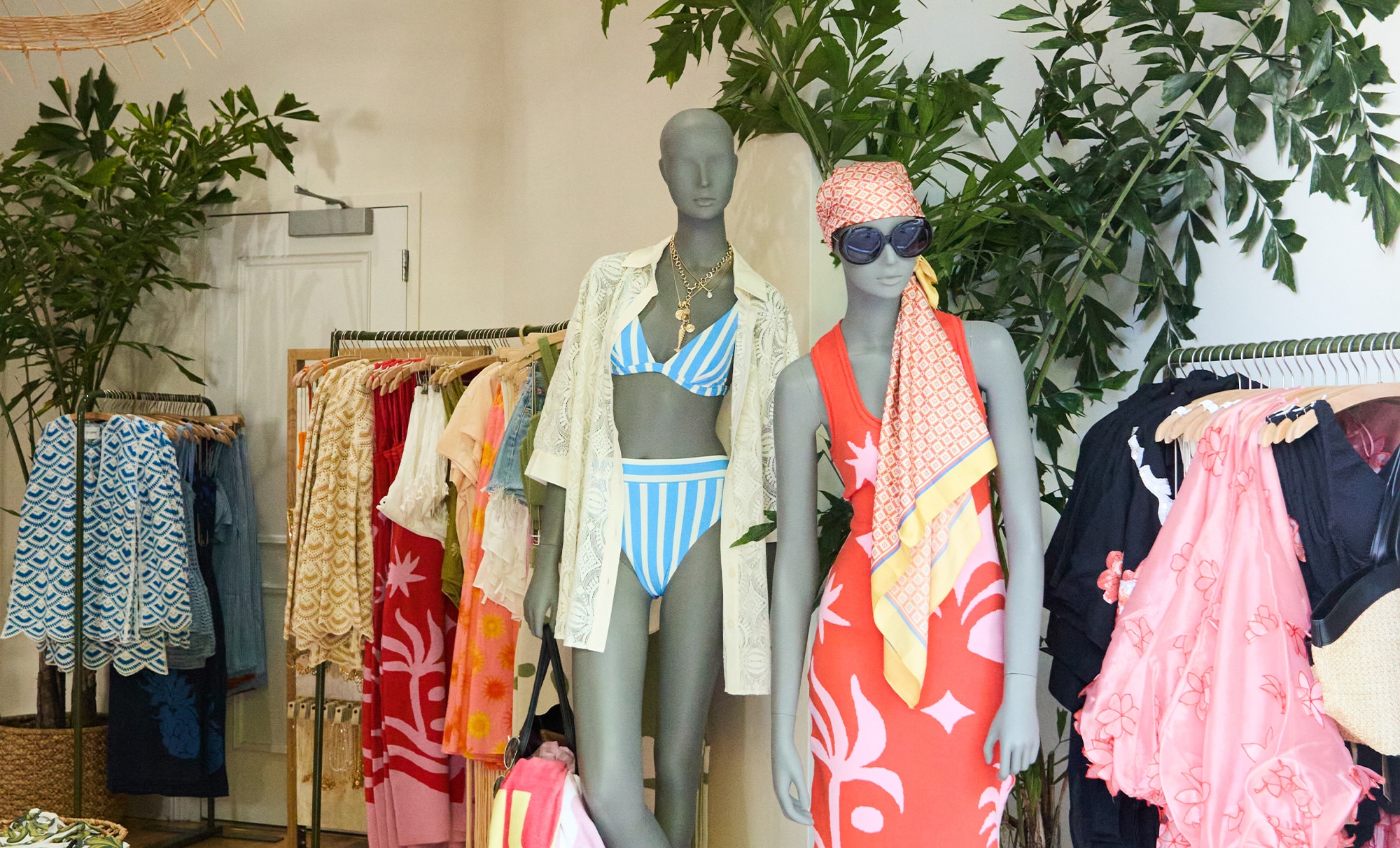 mannequins displaying clothing inside boutique shop